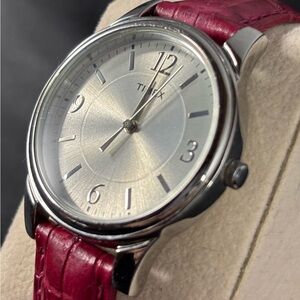 Women’s Timex watch w/large face 
With red leather strap. Like new w/battery37mm